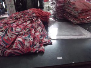 Dresses on a table in factory