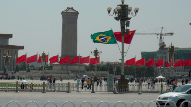 Flags of China and Brazil flying on Tiananmen Square. Photo: Fernando Jácomo