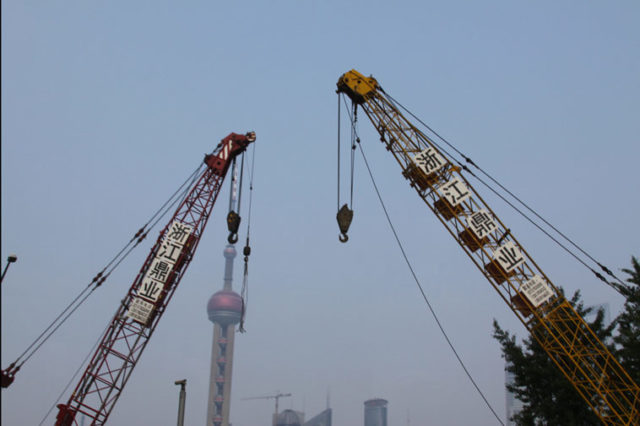 Cranes meet tower. Photo: Hsing Wei