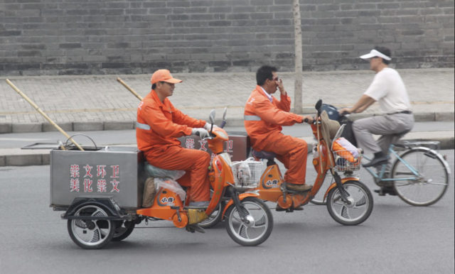 Street cleaners on the move. Photo: Hsing Wei