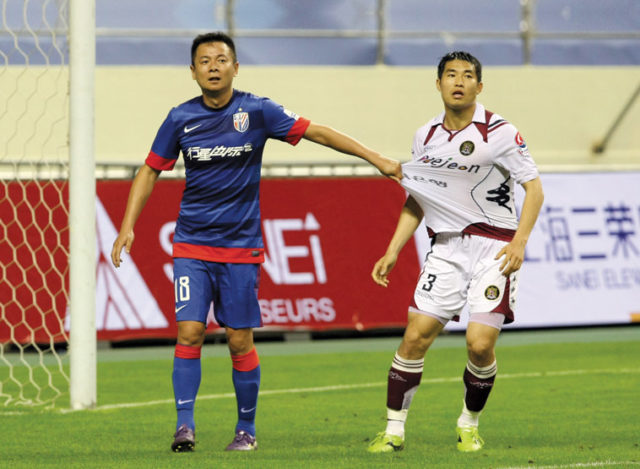 Majority club owner Zhu Jun (left) in the colours of Shanghai Shenhua. Source: ImagineChina