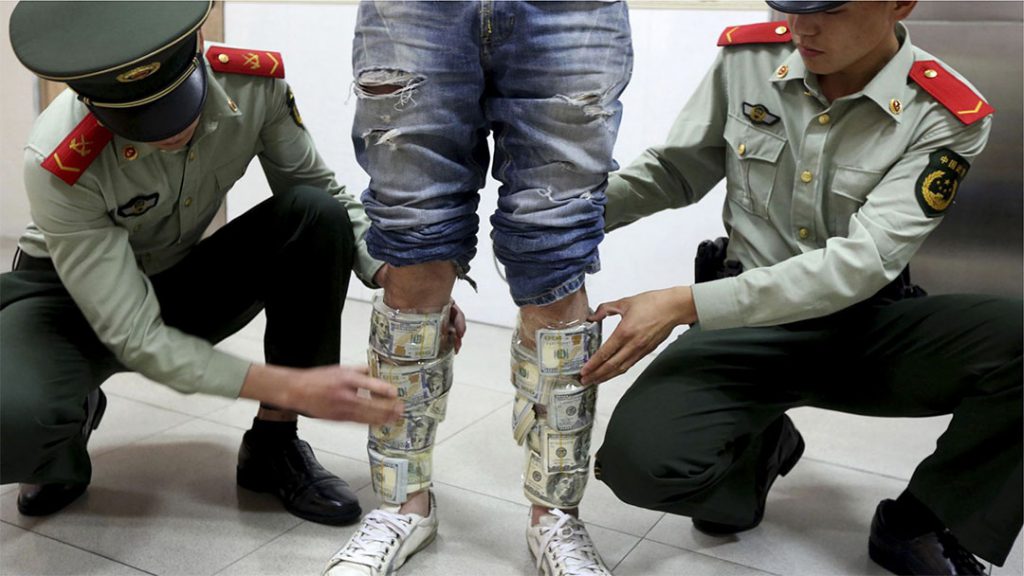 In April 2014, a Hong Kong man was caught trying to cross the border into Shenzhen with US$580,000 taped to his body. In general, travellers are only allowed to carry up to US$5,000 when entering the mainland without submitting a declaration form Photo: China Daily
