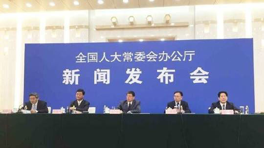 Chinese officials answer questions about a new law regulating foreign NGOs during a press conference at the Great Hall of the People in Beijing Photo: Weibo